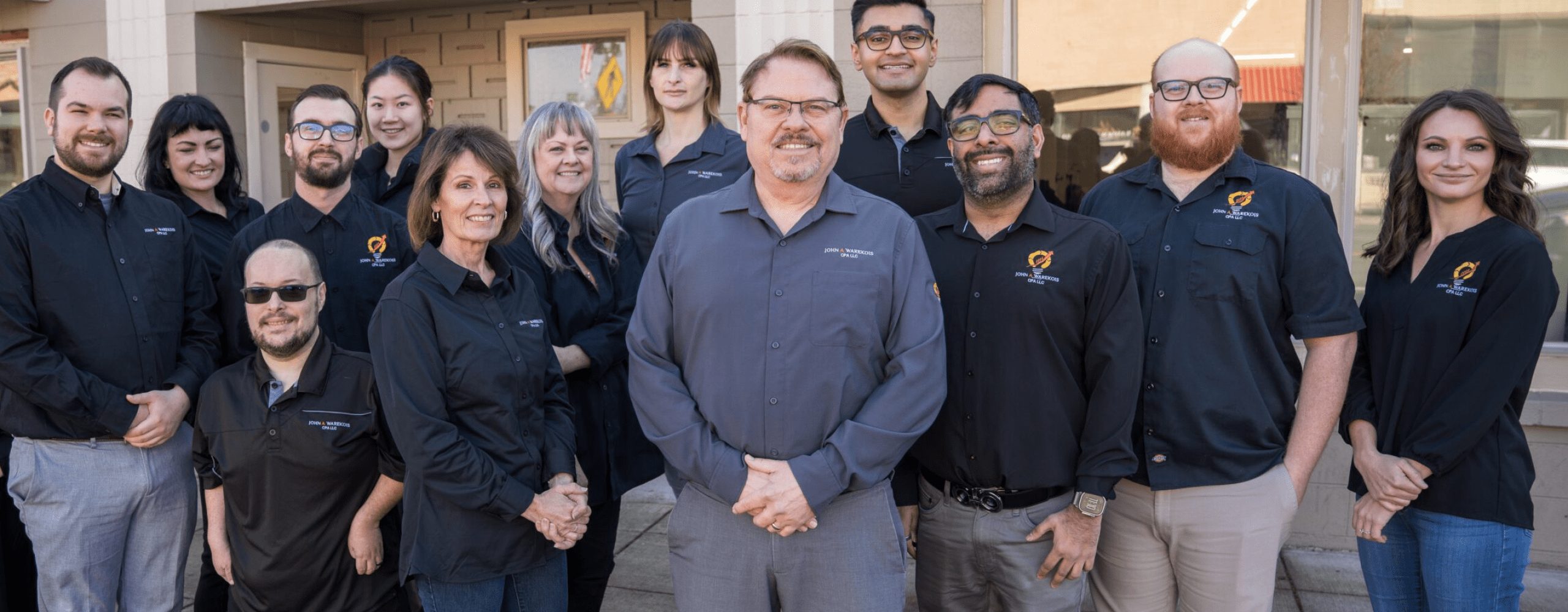 Image of the team in front of the Central Point office