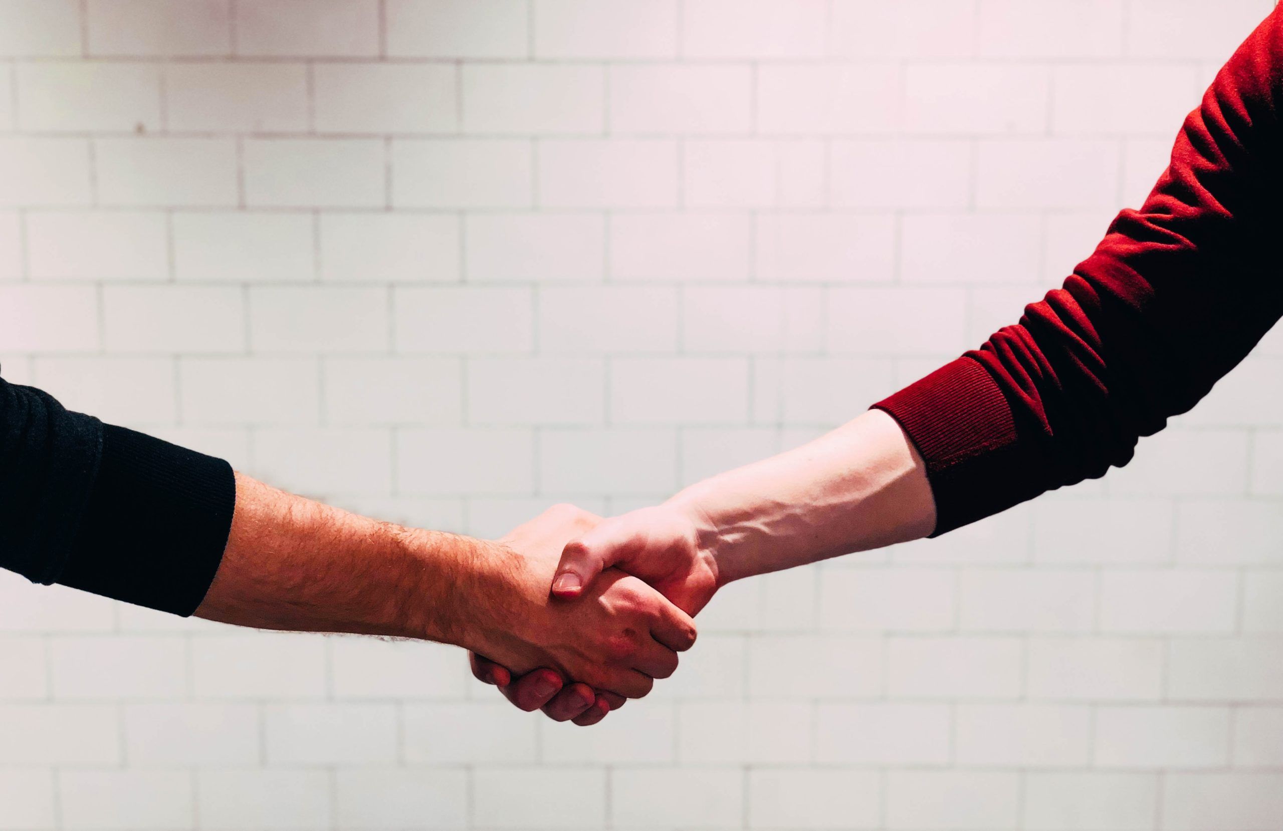 Image of two people shaking hands