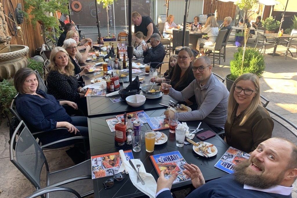 The John A. Warekois team sitting at a restaurant