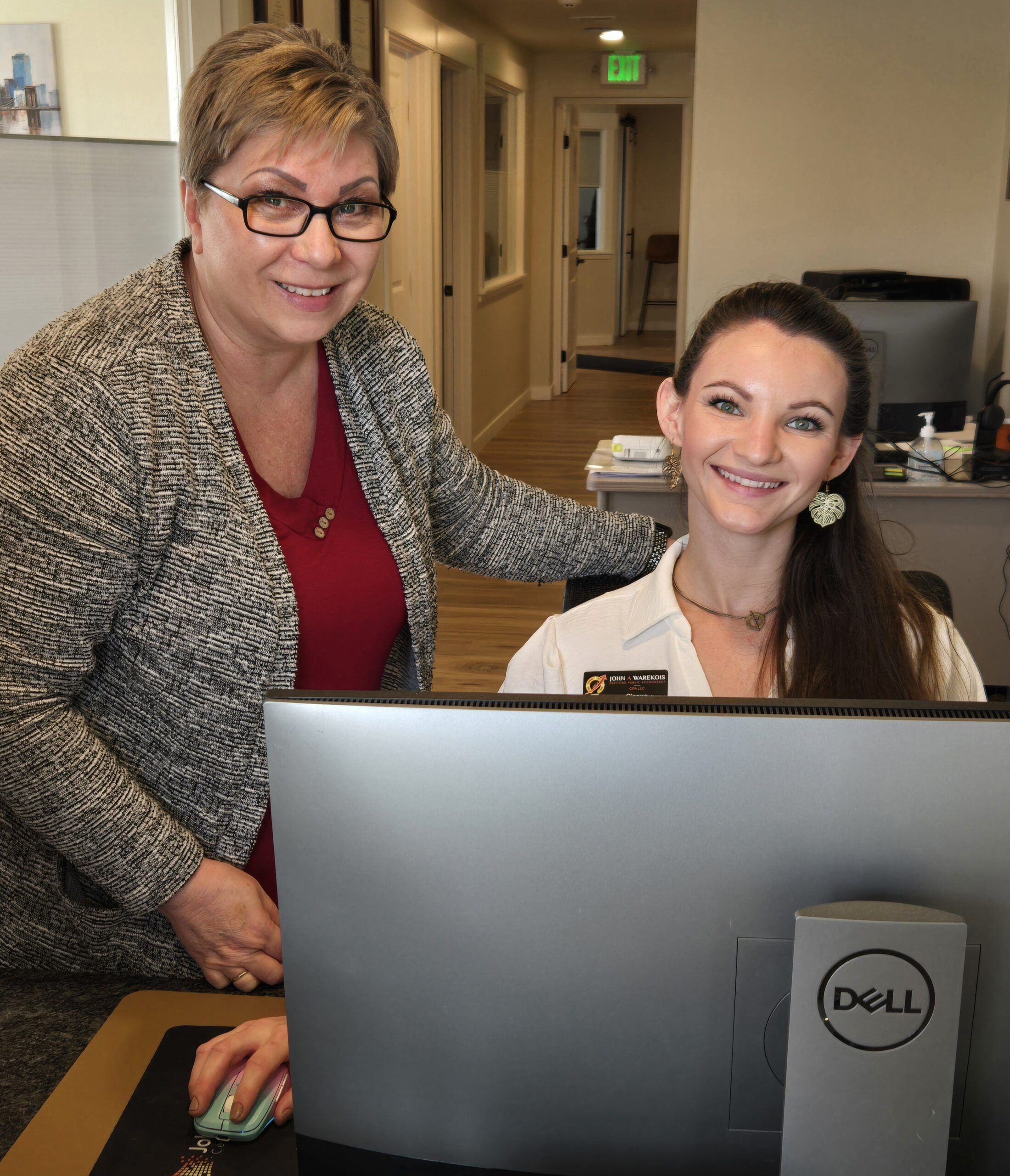 John warekois front desk with two employees waiting to greet customers