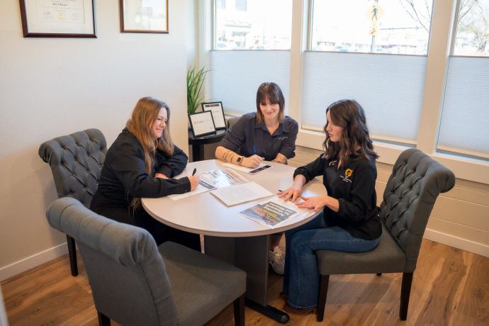 Part of the team sitting around a conference table