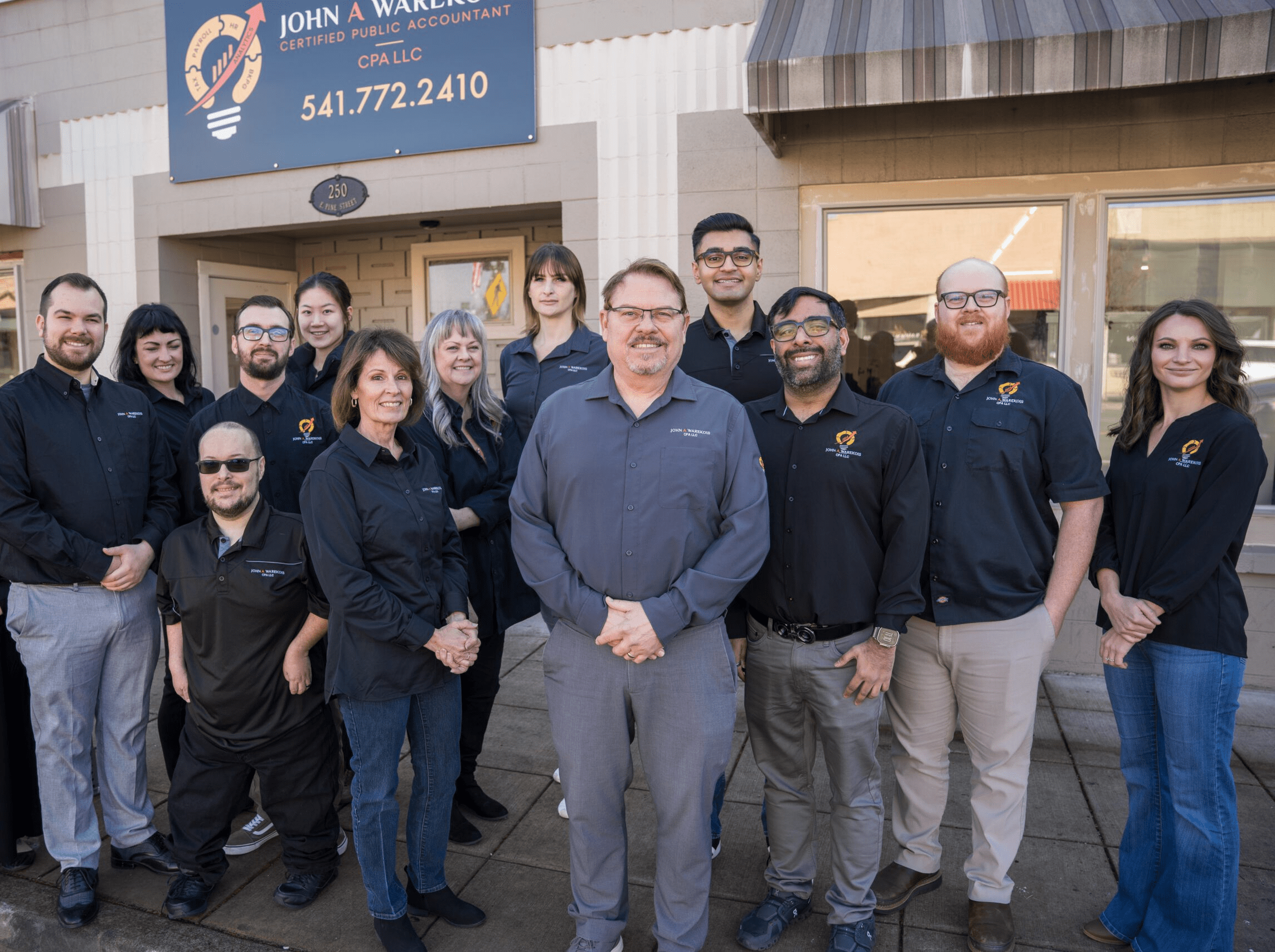 Image of the team in front of the Central Point office