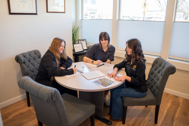 Part of the team sitting around a conference table